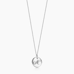 Tiffany Notes Alphabet disc charm pendant. Initial M.